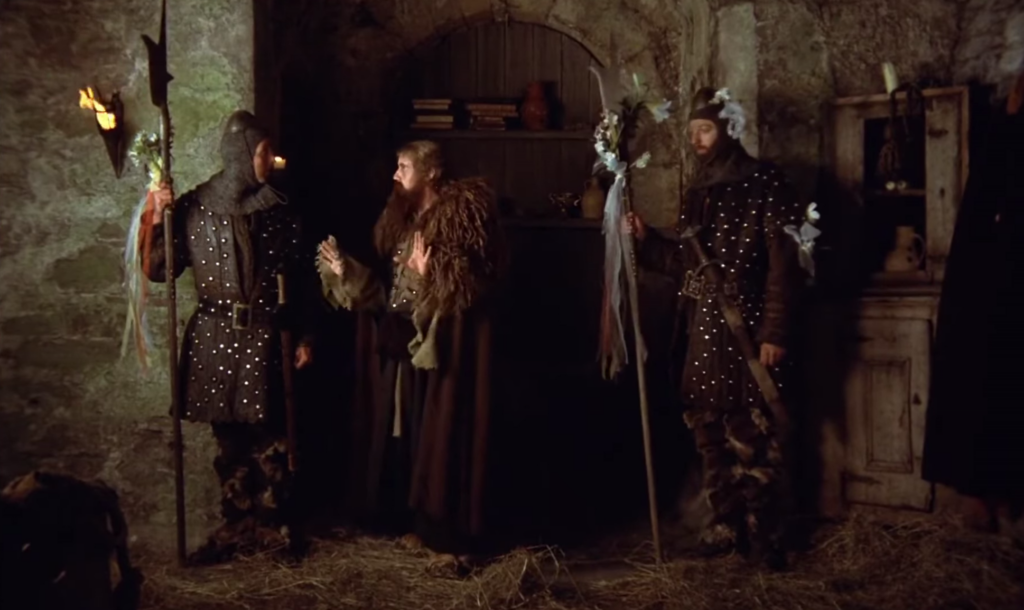 The sketch from Monty Python and the Holy Grail (1975) where the king asks two guards to 